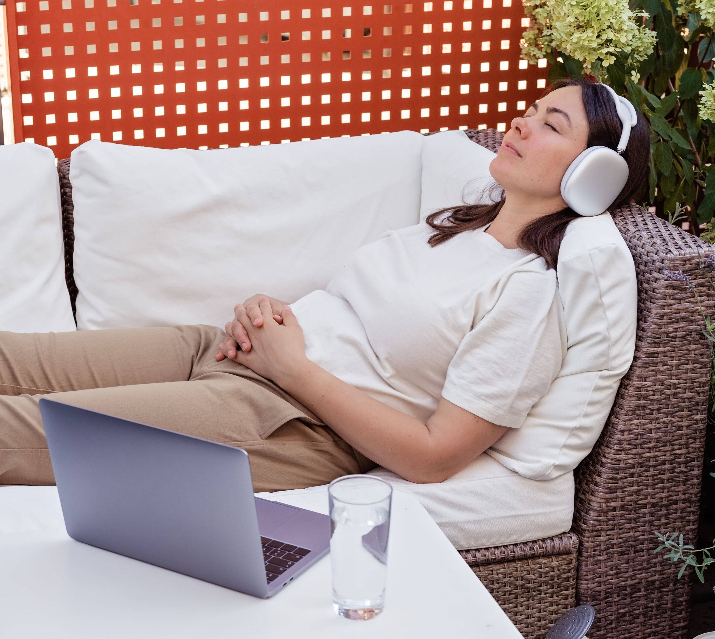 Young woman having online hypnotherapy regression session